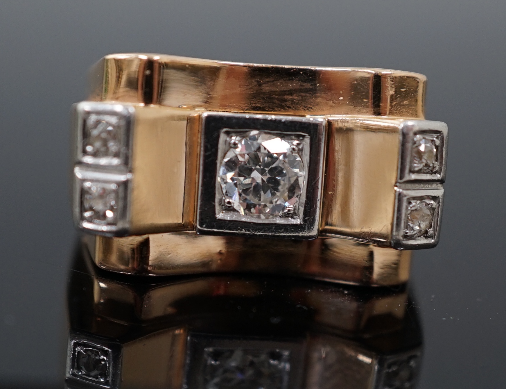 A 1940's 18ct gold and four stone diamond set 'tank' dress ring